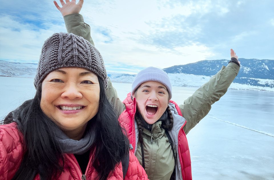 Two women outside enjoying the cold weather on the lake