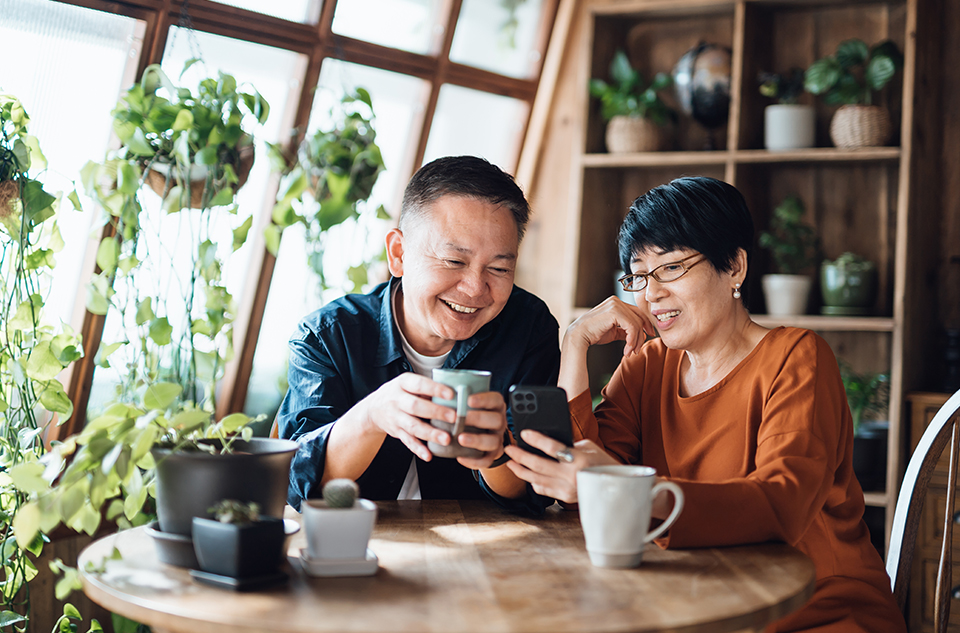 A couple drinking coffee at the table