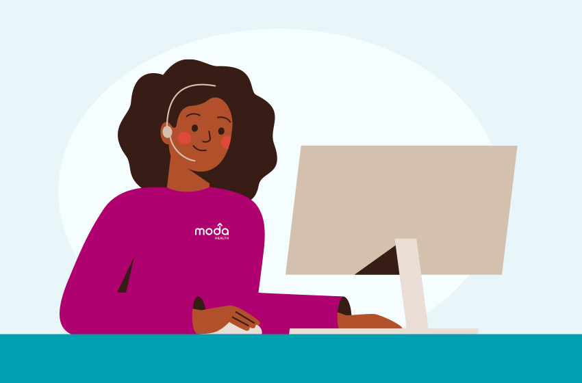 a women on her computer with a headset on