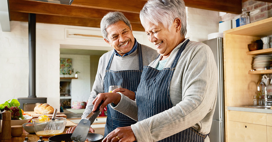 A couple cooking in the kitchen