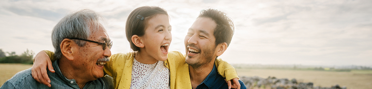 Plans that put you first a family outside smiling and enjoying the fresh air.