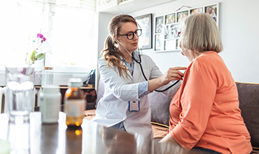 Doctor using stethoscope