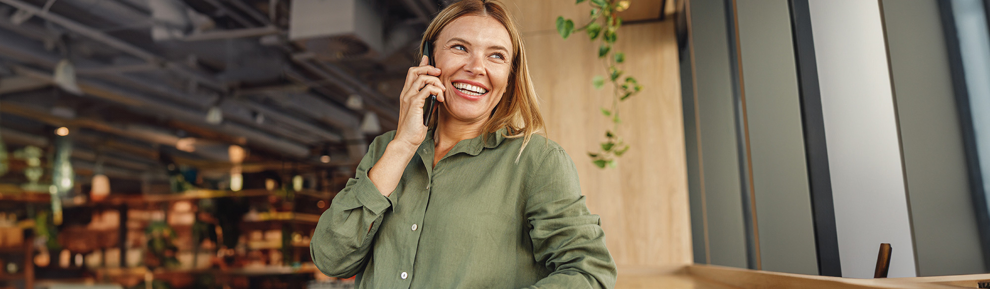 A woman on the phone talking with Customer service 