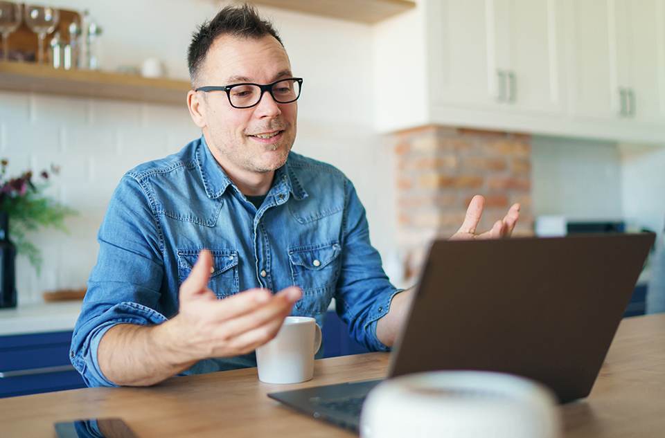 One on one personalized support a man talking on his computer getting support