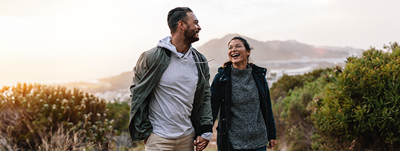 Man and woman holding hands in nature